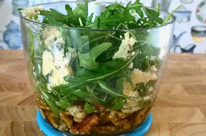 Making rocket pesto in a stick blender mini processor with walnuts and blue cheese