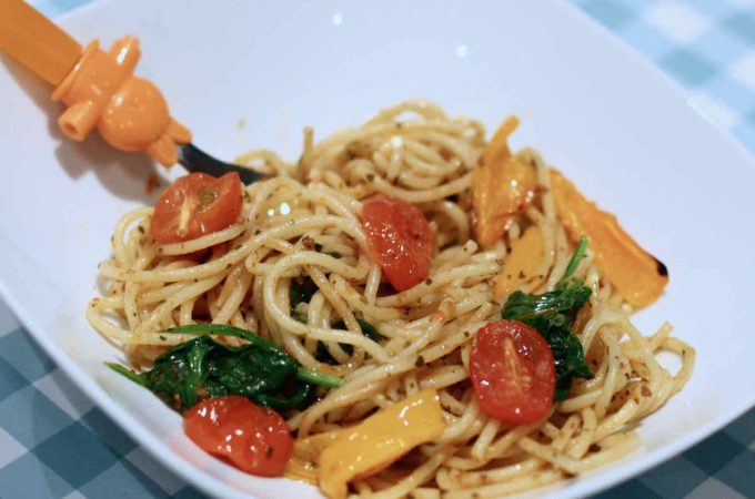 Child's portion of traffic light spaghetti featuring red, orange and green vegetables